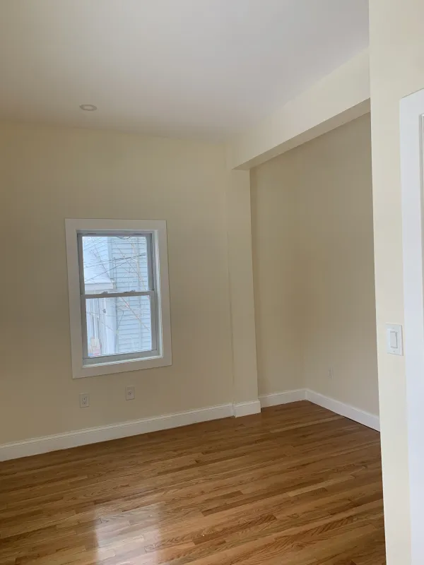 empty-room-hardwood-floors-walls-after.webp