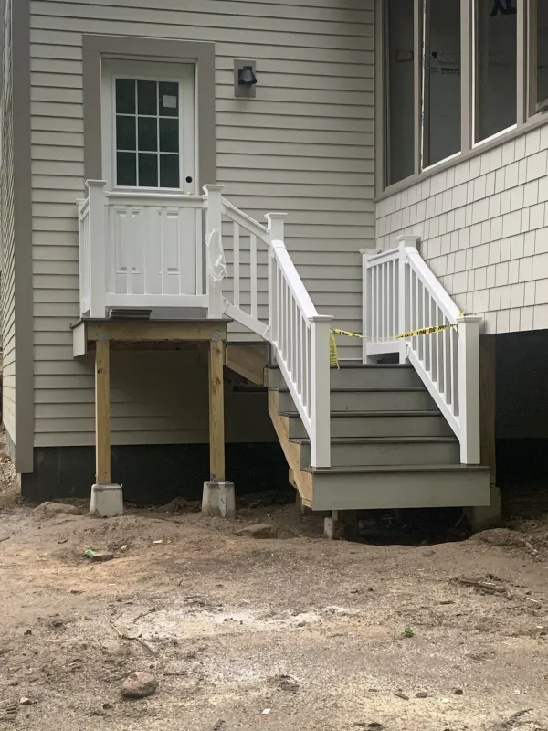 new-deck-stairs-white-railings-after.webp