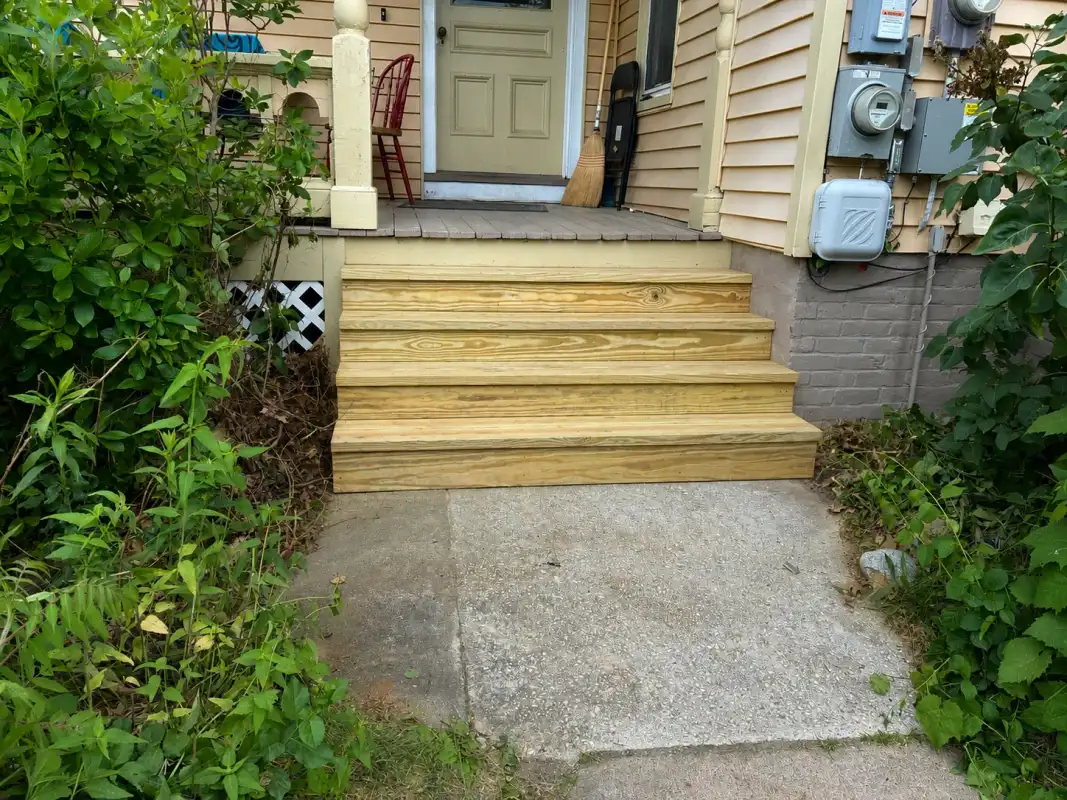 new-wooden-steps-front-porch-after.webp