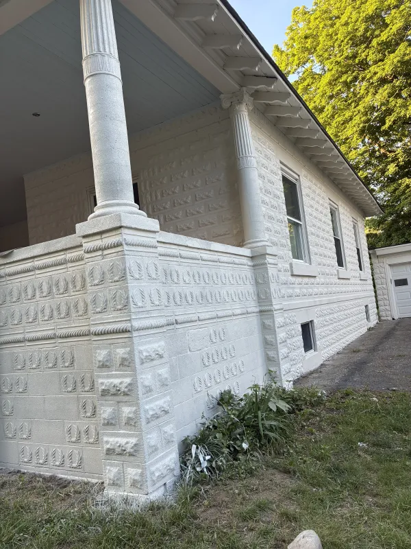 white-stone-facade-columns-trim-after.webp