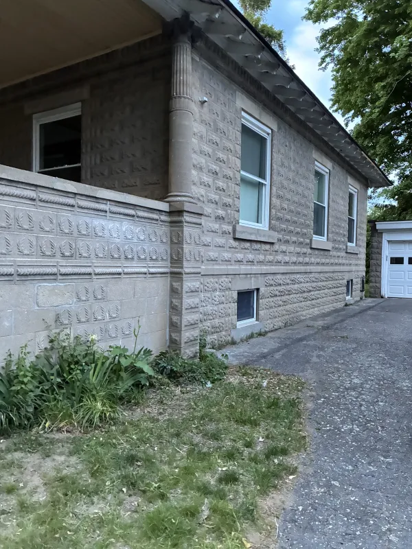 white-stone-facade-columns-trim-before.webp